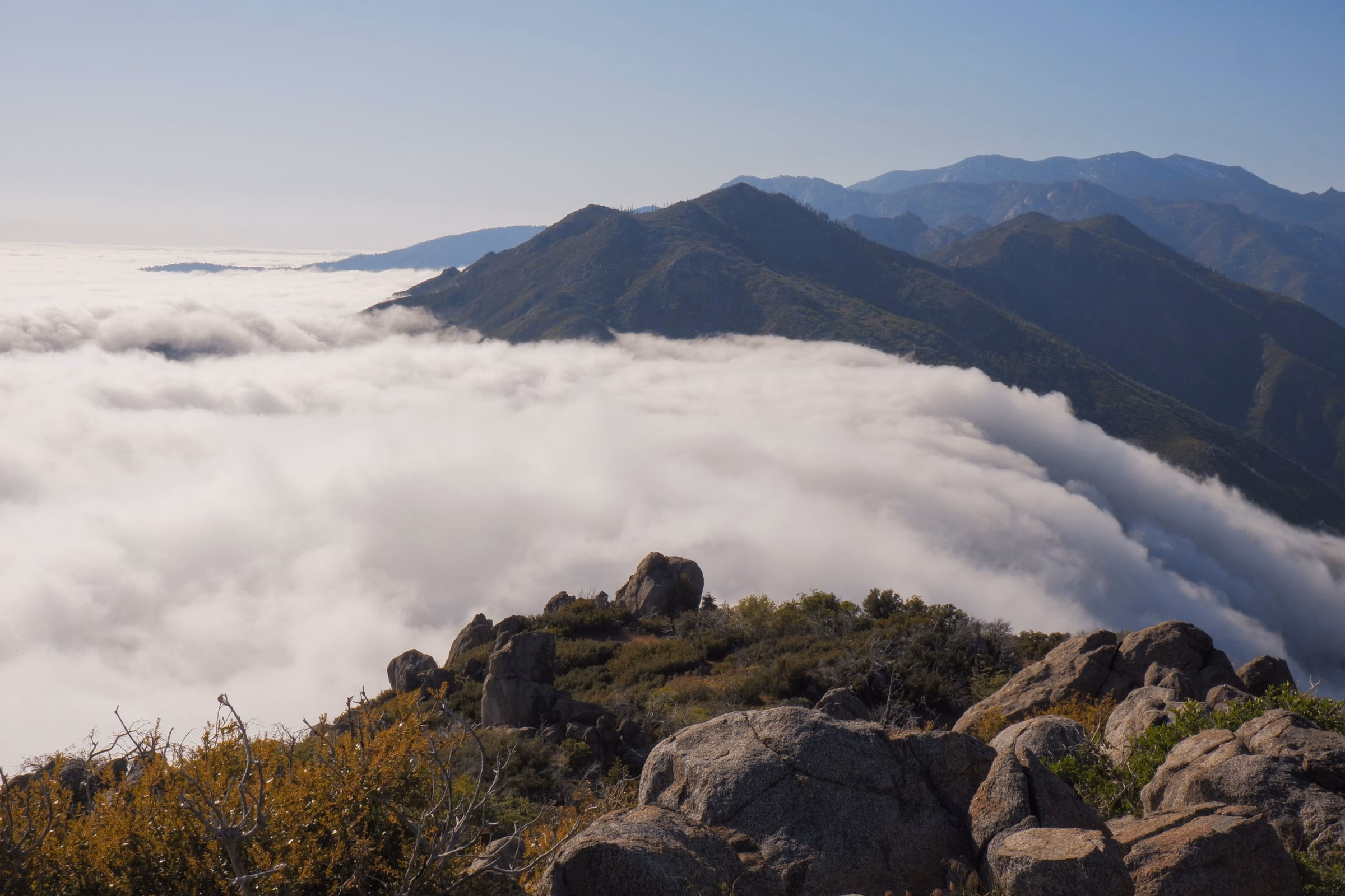 Clouds rolling through the valley along the PCT with the San Jacinto Mountains in the background.